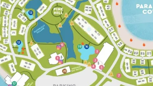A colorful campground map showing sections, buildings, parking areas, and a lake in Pine Hill.